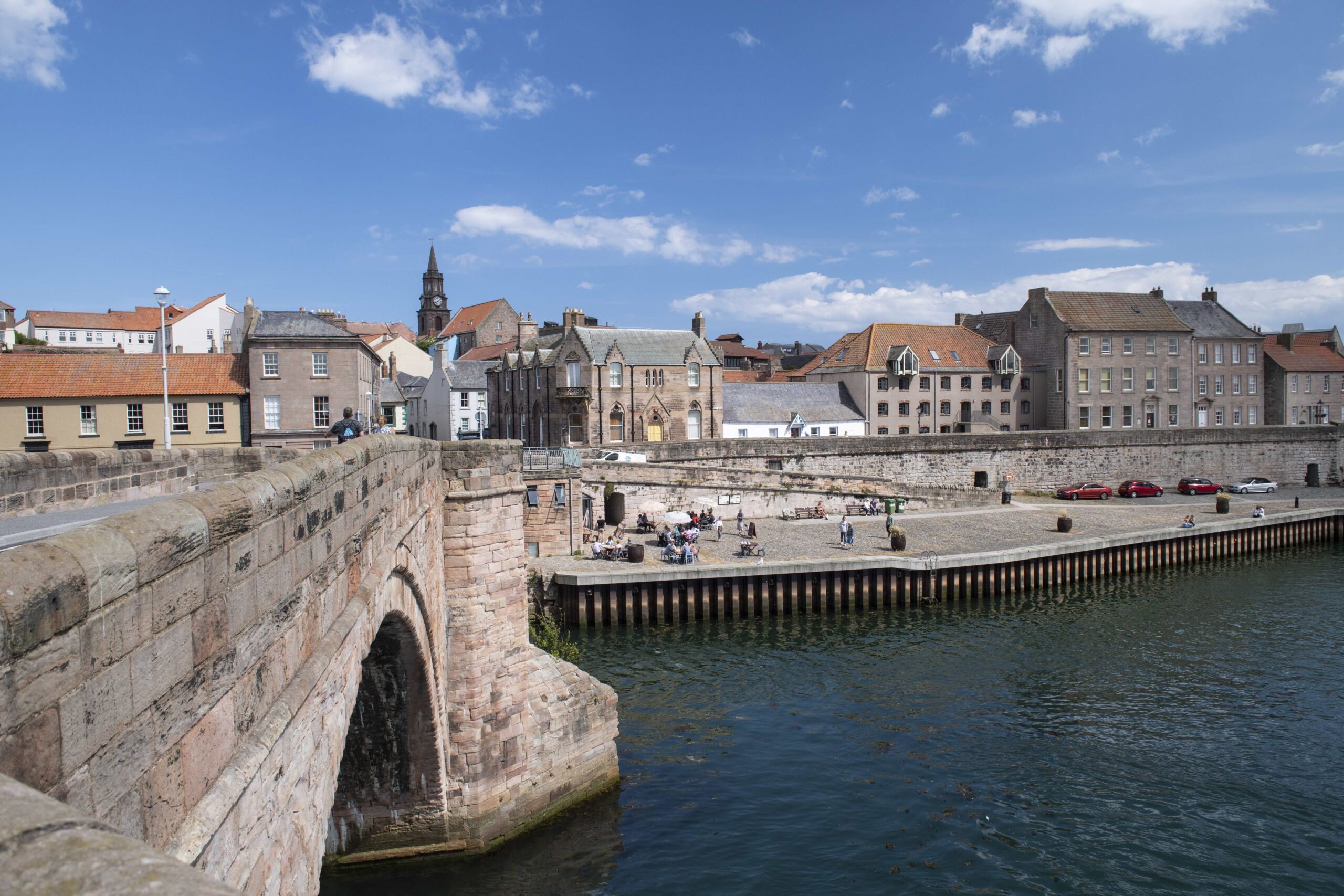 An image of the market town of Berwick-upon-Tweed viewed from the old foot bridge that crosses the river tweed.