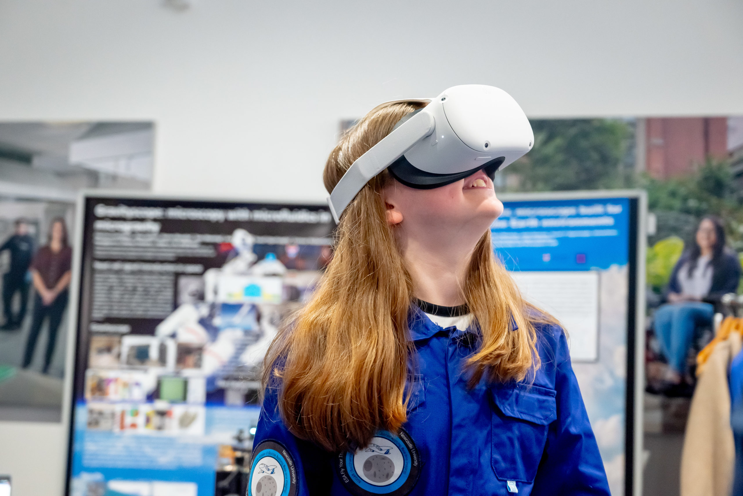 A child looks up through VR goggles
