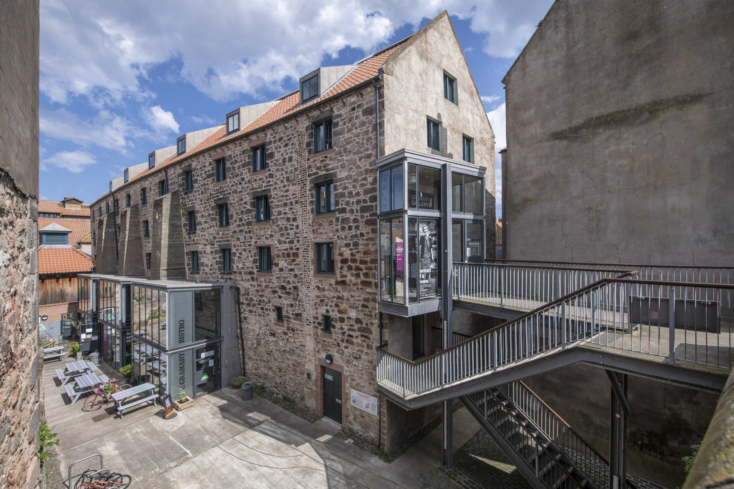 An image of the exterior of an old building with five floors.