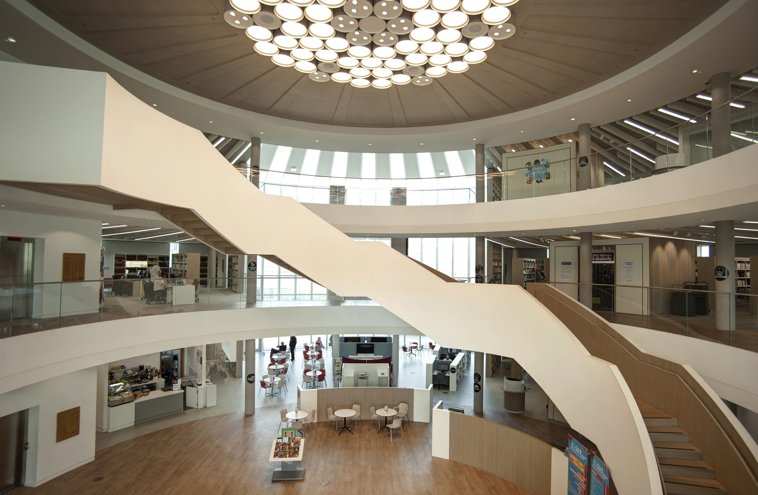 The circular interior of The Word featuring an abstract staircase and three floor levels.